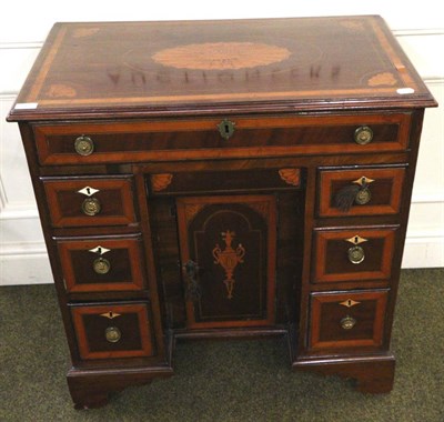 Lot 1417 - A 19th century satinwood inlaid mahogany desk of small proportions