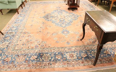 Lot 1419 - Indo-Persian carpet, North India, the pale peach field sparcely decorated with vines around a...