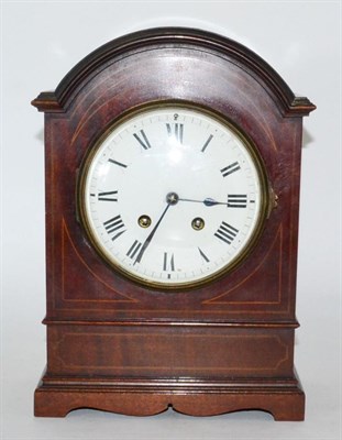 Lot 8 - An Edwardian mantel clock in domed mahogany case