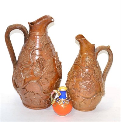Lot 20 - Two salt glazed stoneware jugs and another small china jug