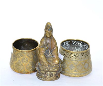 Lot 24 - Two Islamic brass containers and a Chinese patinated metal figure of Guan Yin