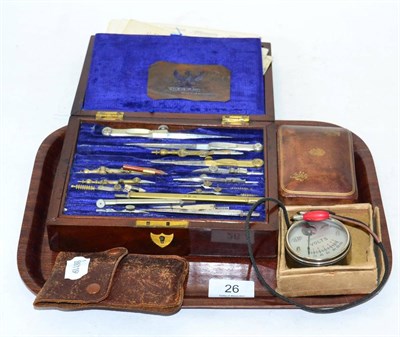 Lot 26 - Edwardian mahogany boxed drawing instruments with ivory handles, leather box and voltmeter