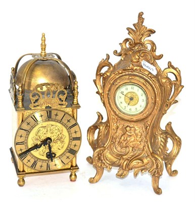 Lot 34 - A gilt metal mantel timepiece and a lantern type mantel timepiece, movement stamped 'Empire'