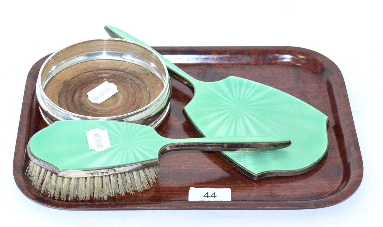 Lot 44 - A silver bottle coaster and a silver and enamel dressing table hand mirror and brush