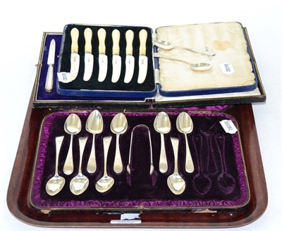 Lot 48 - A cased set of six early 20th century ivory handled tea knives, a cased set of ten silver teaspoons