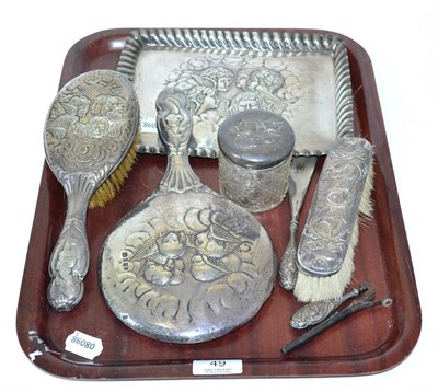 Lot 49 - An early 20th century silver seven piece dressing table set decorated in the Art Nouveau taste