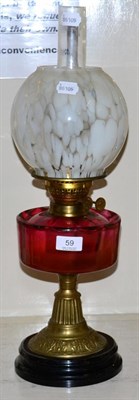 Lot 59 - A cranberry oil lamp