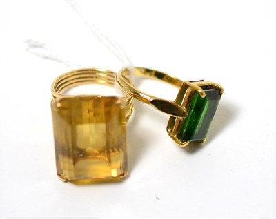 Lot 92 - A green tourmaline ring and a citrine ring (2)