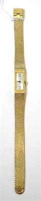 Lot 121 - A 14K gold wristwatch, signed Longines