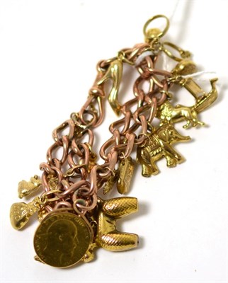 Lot 126 - A charm bracelet with half sovereign