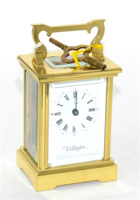 Lot 141 - A brass carriage timepiece, retailed Wellington