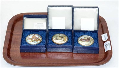 Lot 149 - Three boxed limited edition silver pillboxes with enamelled tops, produced by the St. James's House