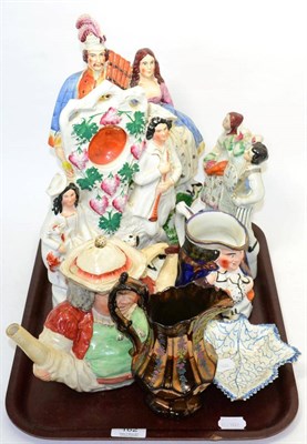 Lot 162 - A group of 19th century ceramics including Staffordshire flatback figures, copper lustre wares,...