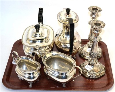 Lot 183 - A pair of Sheffield plate candlesticks and a teaset (6)