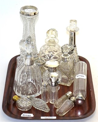 Lot 192 - A quantity of silver mounted and other cut glass scent bottles