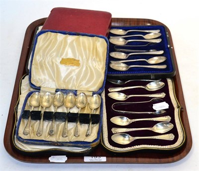 Lot 193 - Two cased sets of teaspoons and sugar tongs, a cased set of six teaspoons with golf club decoration