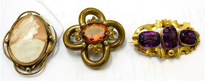 Lot 204 - A Victorian cameo brooch, a purple paste set brooch and another (3)