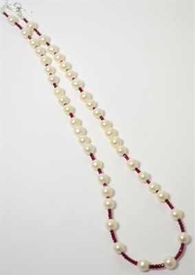 Lot 231 - A cultured pearl and faceted ruby bead necklace