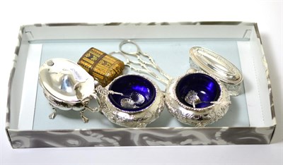 Lot 250 - A pair of silver grape scissors, three silver salts, a silver thimble, a silver topped glass...