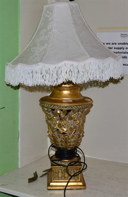 Lot 258 - A decorative gilt composition table lamp