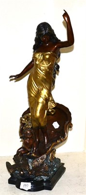 Lot 260 - A Continental spelter figure of a female riding a shell chariot with putto and doves