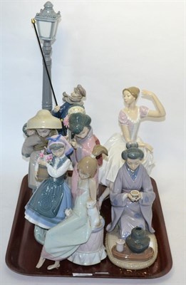 Lot 295 - Seven Lladro figures including Lamplighter, girl with flowers, etc (four boxed)