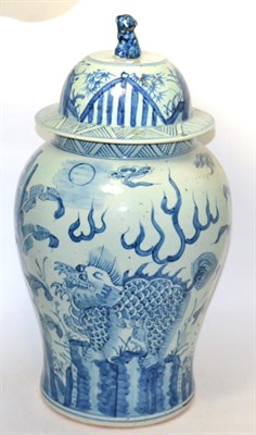 Lot 306 - A Chinese blue and white baluster vase and cover decorated with dragons