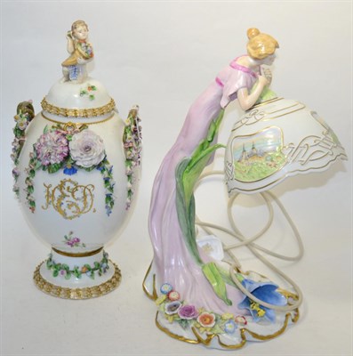 Lot 313 - A Meissen style twin handled vase and cover, surmounted by a cherub bearing a cornucopia, all...