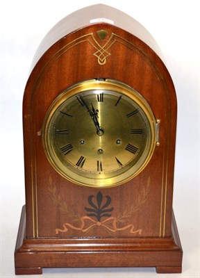 Lot 315 - A mahogany inlaid chiming mantel clock