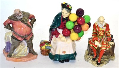 Lot 316 - Three Royal Doulton figures, a Yeoman of the Guard HN688, The Old Balloon Seller HN1315 and...