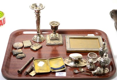 Lot 327 - A group of silver including photograph frame, dwarf candlestick, bud vase, capstan inkwell,...