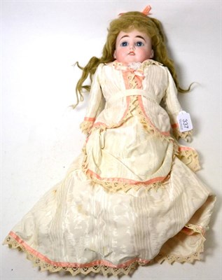 Lot 337 - A bisque china shoulder head doll, with fixed blue eyes, open mouth, kid leather and fabric...