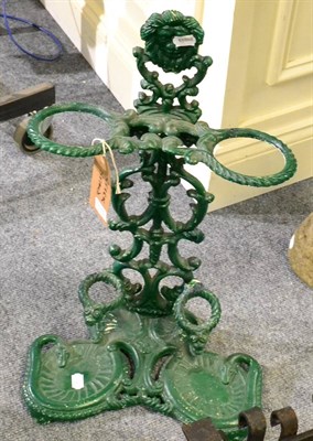 Lot 1076 - A green painted cast iron stick stand