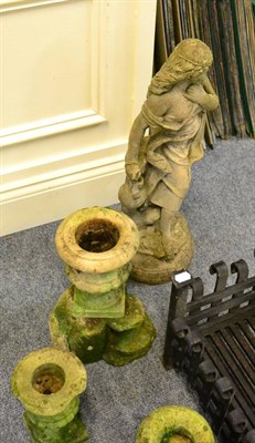 Lot 1095 - Weather stone garden statue of a maiden and a weathered stone bird bath held aloft by a putto