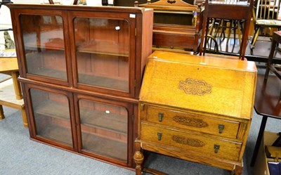 Lot 1109 - An early 20th century oak bureau (a.f.) and a glazed mahogany two tier display cabinet