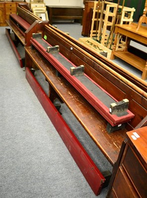 Lot 1119 - A pair of pine church pews, together with six padded kneeling benches