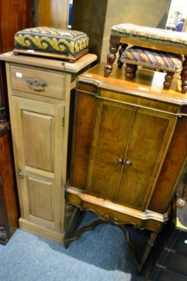 Lot 1127 - A pine tall cupboard together with an oak cocktail cabinet