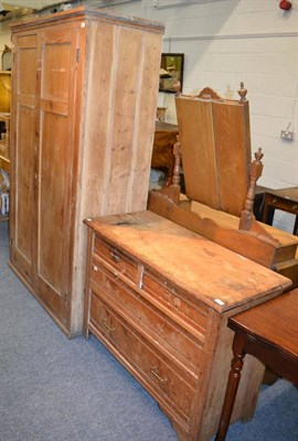 Lot 1138 - A three height chest of drawers, a pine double wardrobe and a pine three height chest