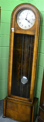 Lot 1266 - An oak cased longcase clock circa 1930's by Enfield, pendulum and three weights