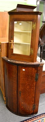 Lot 1271 - A George III bow fronted hanging corner cupboard together with a glazed oak hanging corner cupboard