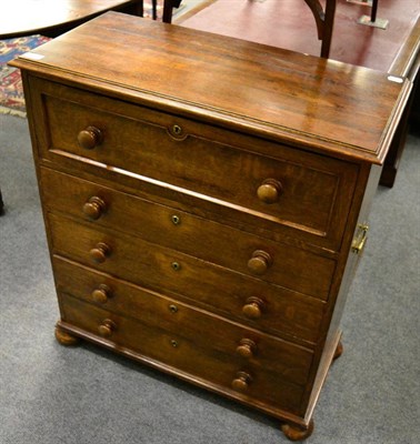 Lot 1290 - A 19th century oak secretaire chest with brass carrying handles