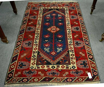 Lot 1295 - A Dofemalti rug, West Anatolia, the indigo lozenge field with central hooked medallions, framed...