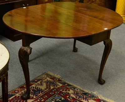 Lot 1299 - An 18th century mahogany gateleg table raised on ball and claw feet