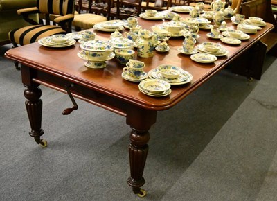 Lot 1304 - A Victorian mahogany wind out dining able raised on gadroon legs and with two additional leaves