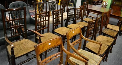 Lot 1308 - A composite set of ten spindle back rush seated dining chairs, includes two carvers (10)