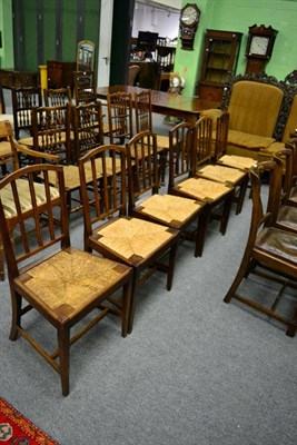 Lot 1311 - A set of six Georgian oak dining chairs