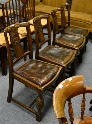 Lot 1312 - A set of four 1920's oak dining chairs