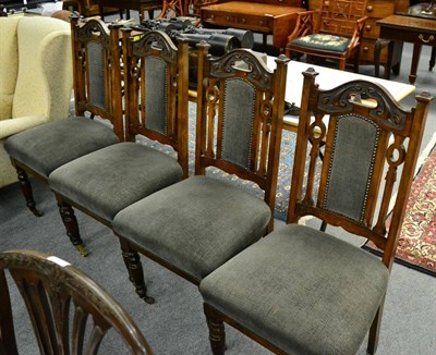 Lot 1328 - A set of four carved mahogany dining chairs