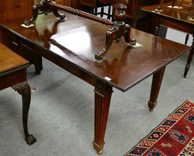 Lot 1335 - A mahogany draw leaf dining table with one additional leaf