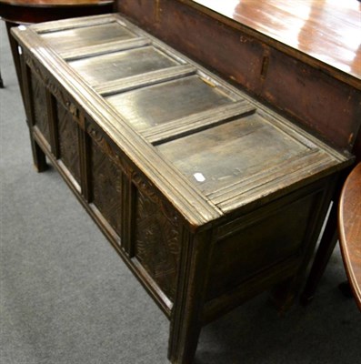 Lot 1340 - A late 17th century oak coffer with carved panels and stile-ends